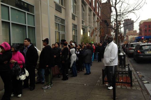 New York Cares says, "Clients at the East Harlem Asthma Center for Excellence, seen here, were lining up 1 - 2 hours before the scheduled distribution time, and the coats ran out before everyone could get one."